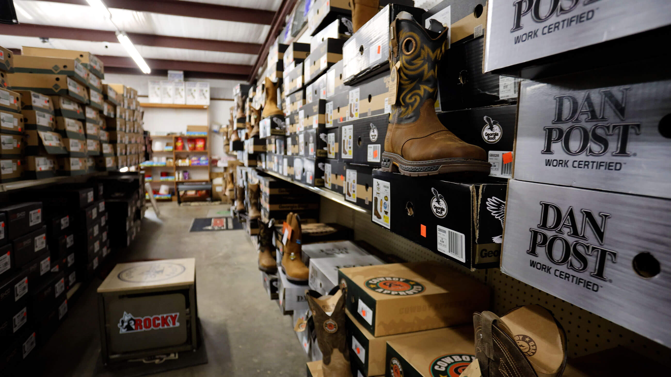 Wall of work and western boots from Rocky, Georgia Boot and Dan Post